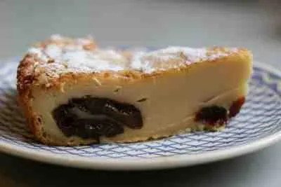 Far Breton is a specialty of the Brittany (or Bretagne as it is known locally) region of France. It is a very simple flan like cake and includes prunes, which are sometimes soaked beforehand in brandy.