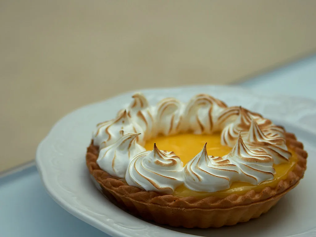 A lemon tart topped with browned meringue.