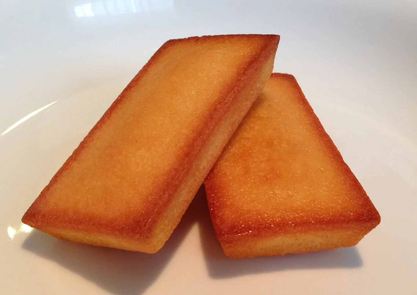 Two rectangular almond financiers.
