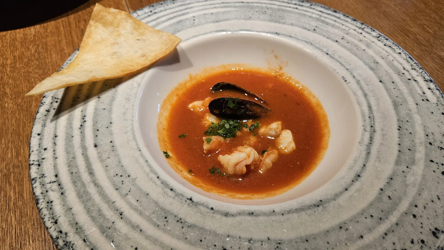 A plated restaurant interpretation of bouillabaisse.