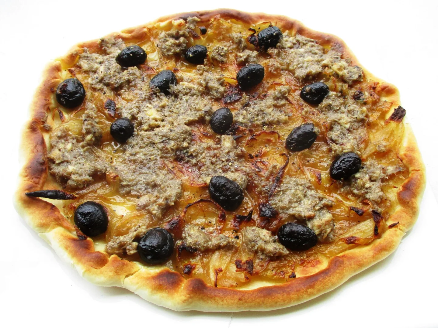 A pissaladière topped with onions and olives.