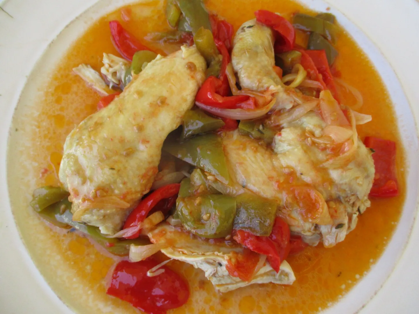 Chicken with a Basque-style tomato and pepper preparation.