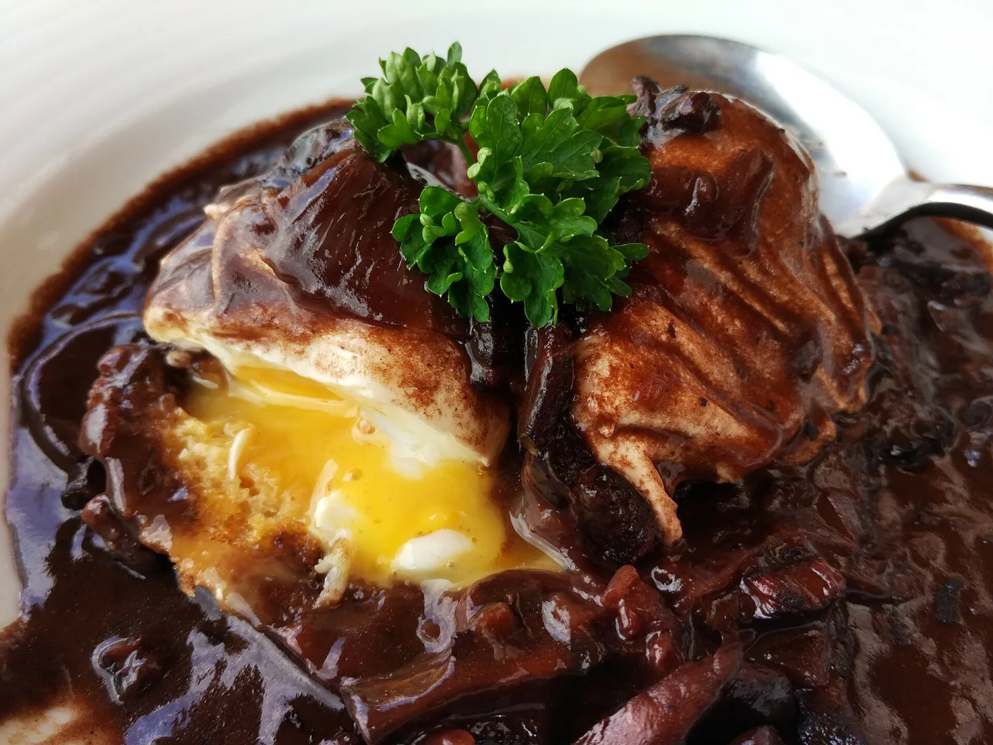 A poached egg with a rich meurette sauce.