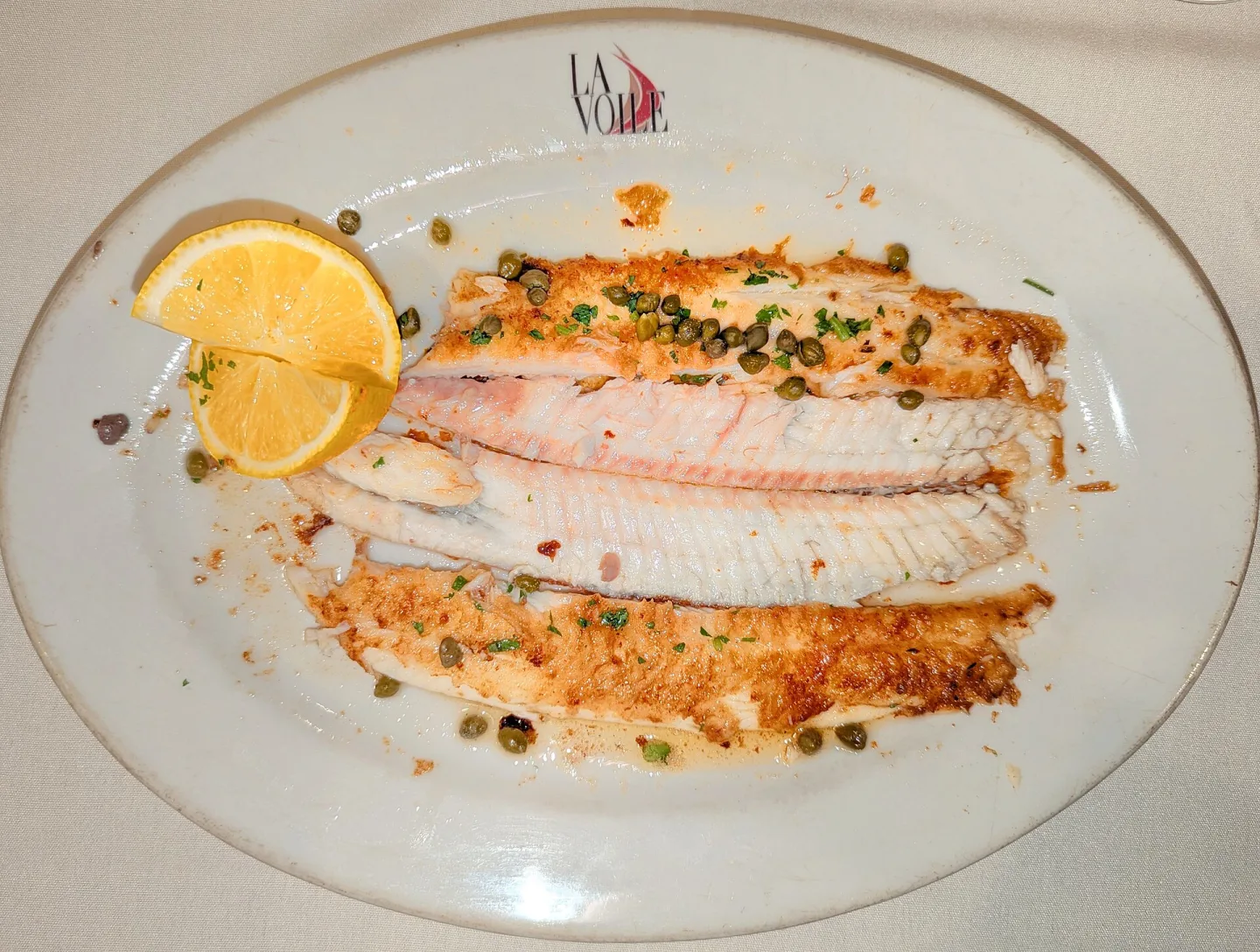 Sole meunière served with lemon.