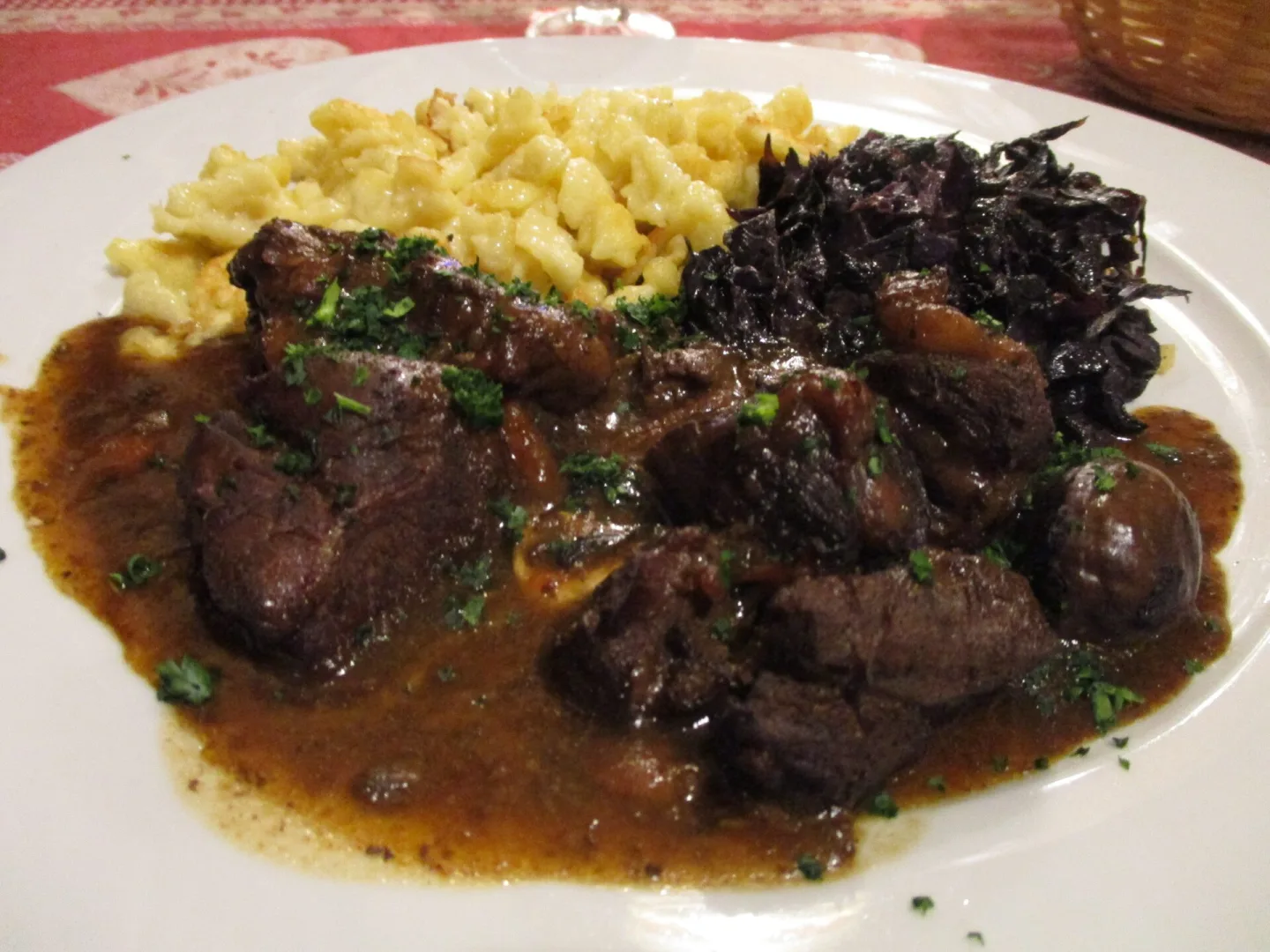 Wild boar civet served with an accompaniment.