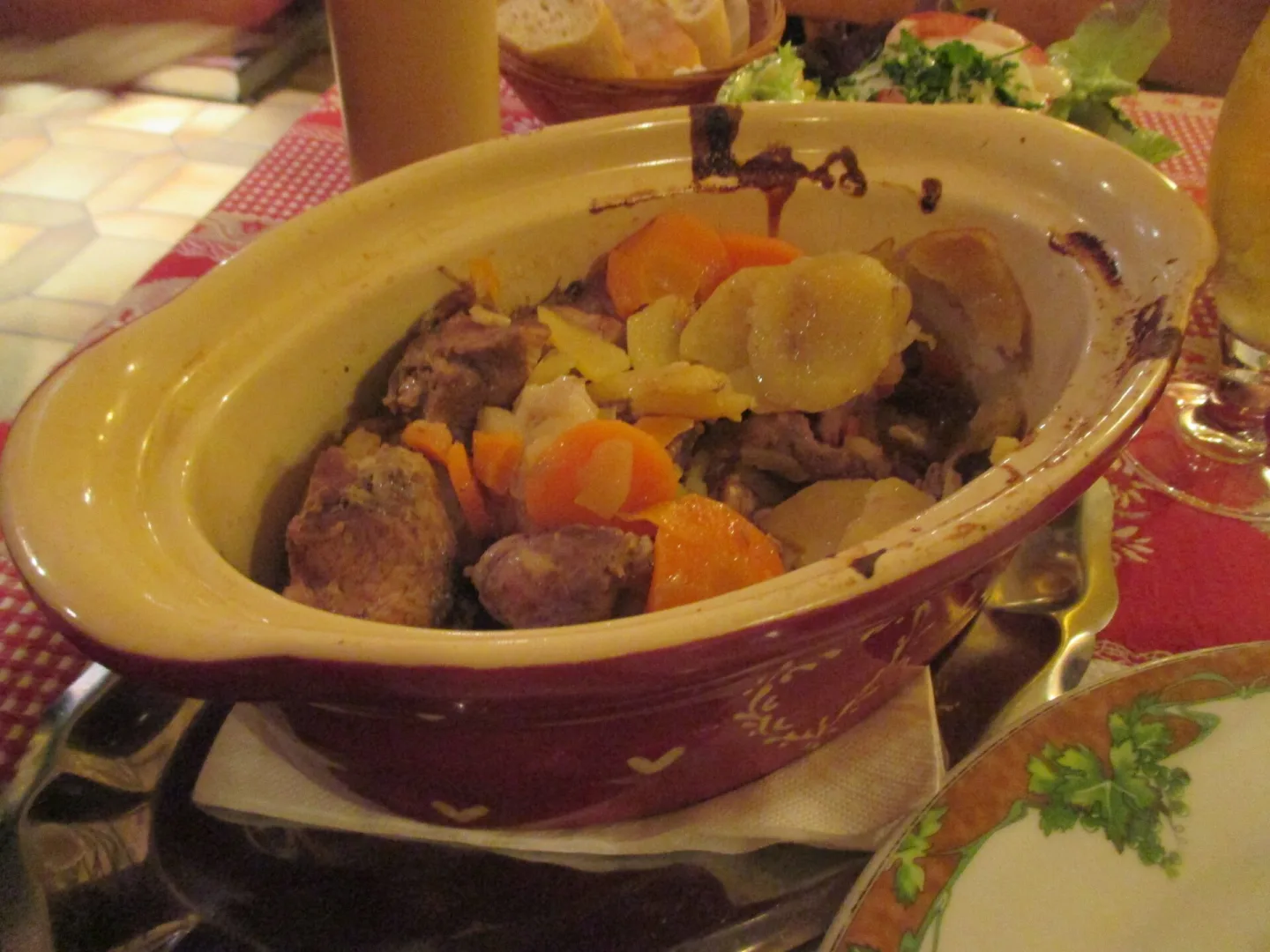 Baeckeoffe served in an earthenware casserole.