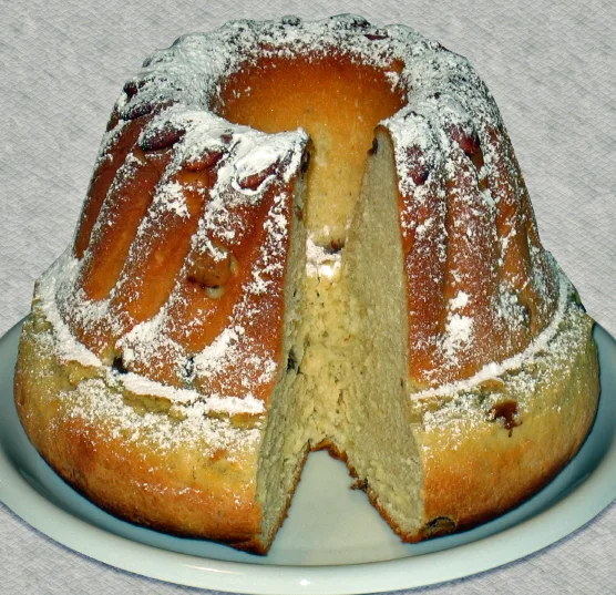 Sweet kougelhopf with a slice cut from its fluted ring.